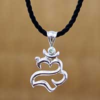 Peridot pendant necklace, 'Balinese Om' - Artisan Crafted Silver and Peridot pendant Necklace