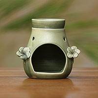 Ceramic oil warmer, 'Frangipani Dreams' - Handcrafted Green Floral Ceramic Oil Warmer from Bali