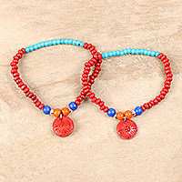 Wood beaded stretch bracelets, 'Energetic Colors' (pair) - Colorful Wood Beaded Stretch Bracelets (Pair)
