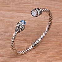 Blue topaz cuff bracelet, 'Flourish in Blue' - Balinese Blue Topaz and Sterling Silver Cuff Bracelet