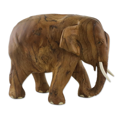 Teak wood sculpture, 'Go For a Walk' (left) - Teak Wood Sculpture of a Left-Facing Elephant from Thailand