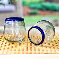 Handblown stemless wine glasses, 'Cobalt Day' (pair) - Cobalt Blue and Clear Handblown Stemless Wine Glasses (Pair)