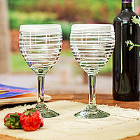 Handblown wine glasses, 'White Spirals' (pair) - Pair of White Handblown Wine Glasses with Spiral Motifs