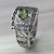 Peridot cocktail ring, 'Bali Temple' - Handcrafted Peridot Ring with Silver Cutout Motifs