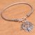 Blue topaz charm bracelet, 'Beaming Butterfly' - Sterling Silver and Blue Topaz Butterfly Charm Bracelet