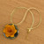 Gold-accented wood and horn pendant necklace, 'Marigold Floral Splendor' - Gold-Accented Wood & Horn Handmade Floral Pendant Necklace