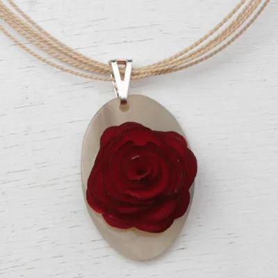 Wood and horn pendant necklace, 'Rose Oval' - Oval Eucalyptus Wood and Horn Floral Pendant Necklace