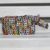 Recycled aluminum pop-top wristlet, 'Eco-Friendly Rainbow' - Colorful Recycled Aluminum Pop-Top Wristlet from Brazil