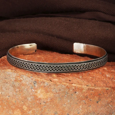 Sterling silver cuff bracelet, 'Tie to Magnificence' - Traditional Oxidized Folk Art Sterling Silver Cuff Bracelet