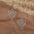 Sterling silver dangle earrings, 'Heartfelt Fantasy' - Romantic-Themed Heart-Shaped Sterling Silver Dangle Earrings