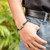 Jade pendant bracelet, 'Spirited Freedom' - Handcrafted Faux Leather and Jade Braided Pendant Bracelet