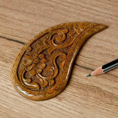 Wood magnet, 'The Paisley Eden' - Hand-Carved Paisley-Shaped Floral Walnut Wood Magnet