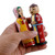 Wood figurines, 'Majestic Marriage' (set of 2) - Set of 2 Yellow and Red Wood Bride and Groom Figurines