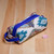 Ikat cotton cosmetic bag, 'Hypnotic Patterns' - Handmade Uzbek Ikat Cotton Cosmetic Bag with Handle