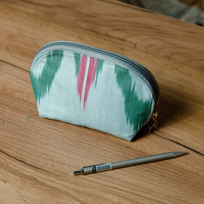 Ikat cotton cosmetic bag, 'Trendy Patterns' - Cotton Cosmetic Bag with Ikat Patterns Crafted in Uzbekistan