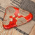 Glazed ceramic platter, 'Abundance Realm' - Triangular Red-Orange Ceramic Platter with Traditional Theme