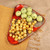 Glazed ceramic platter, 'Abundance Realm' - Triangular Red-Orange Ceramic Platter with Traditional Theme