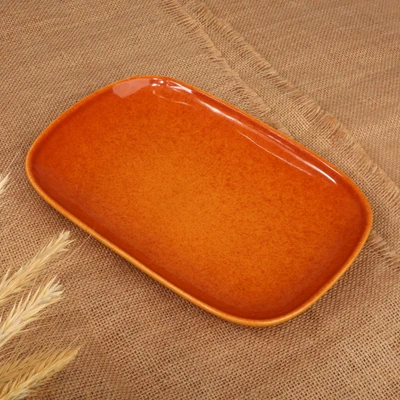 Ceramic plate, 'Honey Auras' - Oblong-Shaped Honey Brown Ceramic Plate in a Glazed Finish