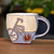 Ceramic mug, 'Serene Memories' - Handcrafted Whimsical Blue and Beige Ceramic Mug