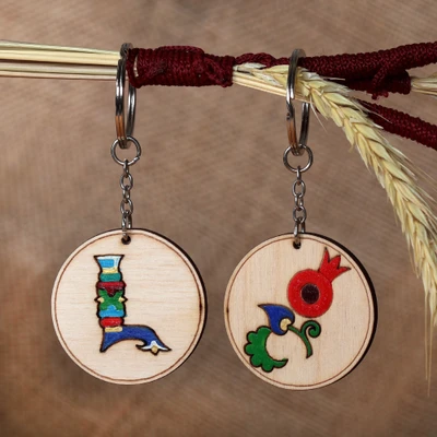Wood keychain, 'Auguring L' (set of 2) - Pomegranate and Letter L-Themed 2-Piece Wood Keychain Set