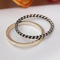 Sterling silver stacking rings, 'Enigmatic Twists' (set of 2) - Matte and Oxidized 2-Piece Sterling Silver Stacking Ring Set