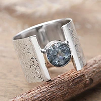 Blue topaz single stone ring, 'Distinguished Blue' - Modern Floral-Patterned 1-Carat Blue Topaz Single Stone Ring