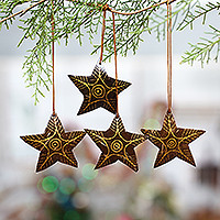 Coconut shell ornaments, 'Bright Lights in the Sky' (set of 4) - Set of 4 Handmade Brown Coconut Shell Star Ornaments