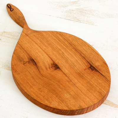 Mahogany wood cutting board, 'Twist of Nature' - Hand Carved Cutting Board Natural Wood Color from Nicaragua
