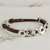 Fine silver wristband bracelet, 'Friendship Buttons in Brown' - Fine Silver and Leather Wristband Bracelet from Guatemala