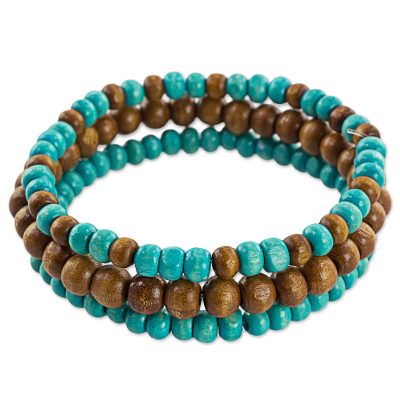 Wood beaded stretch bracelets, 'Blue Force' (set of 3) - Brown and Blue Wood Beaded Bracelets (Set of 3) Guatemala