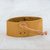 Leather wristband bracelet, 'Energetic' - Mustard Leather Coconut Shell Pendant Wristband Bracelet