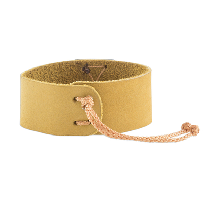 Leather wristband bracelet, 'Energetic' - Mustard Leather Coconut Shell Pendant Wristband Bracelet