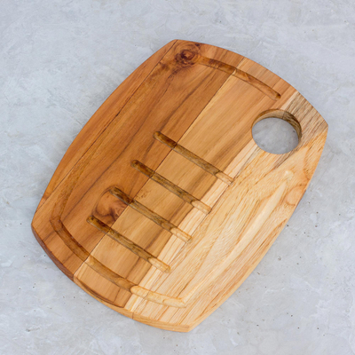 Teak wood carving board, 'Presentation' - Handcrafted Teak Wood Carving Board with Grooves