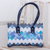 Recycled magazine shoulder bag, 'Modern Waves' - Handcrafted Blue Recycled Magazine Paper Shoulder Bag thumbail