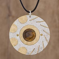 Tiger's eye pendant necklace, 'Shining Suns' - Modern Tiger's Eye and Brass Circle Pendant Necklace