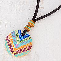 Wood pendant necklace, 'Mayan Evolution' - Hand-Painted Pinewood Pendant Necklace from Guatemala