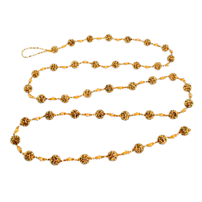 Glass beaded garland, 'Golden Silhouettes' - Glass Beaded Garland in Orange from Guatemala