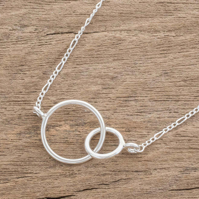 Sterling silver pendant necklace, 'Connected Rings' - Circular Sterling Silver Pendant Necklace from Guatemala