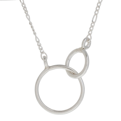 Sterling silver pendant necklace, 'Connected Rings' - Circular Sterling Silver Pendant Necklace from Guatemala