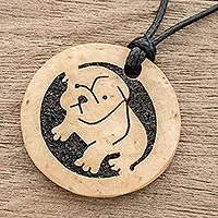 Coconut shell and lava stone pendant necklace, Bulldog