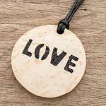 Coconut shell and lava stone pendant necklace, 'Have Love' - Love-Themed Coconut Shell and Lava Stone Pendant Necklace