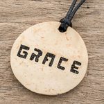 Coconut shell and lava stone pendant necklace, 'Have Grace' - Grace-Themed Coconut Shell and Lava Stone Pendant Necklace