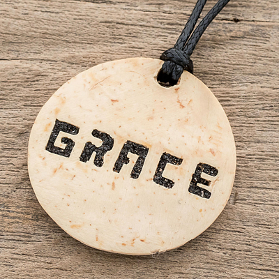 Coconut shell and lava stone pendant necklace, 'Have Grace' - Grace-Themed Coconut Shell and Lava Stone Pendant Necklace