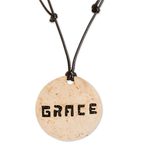 Coconut shell and lava stone pendant necklace, 'Have Grace' - Grace-Themed Coconut Shell and Lava Stone Pendant Necklace