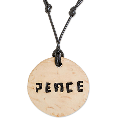 Coconut shell and lava stone pendant necklace, 'Have Peace' - Peace-Themed Coconut Shell and Lava Stone Pendant Necklace