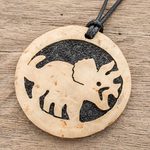 Coconut shell and lava stone pendant necklace, 'Triceratops' - Coconut Shell and Lava Stone Triceratops Pendant Necklace