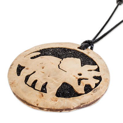 Coconut shell and lava stone pendant necklace, 'Triceratops' - Coconut Shell and Lava Stone Triceratops Pendant Necklace