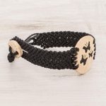 Coconut shell and lava stone macrame pendant bracelet, 'Three Butterflies' - Butterfly Motif Coconut Shell and Lava Stone Bracelet