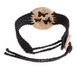 Coconut shell and lava stone macrame pendant bracelet, 'Three Butterflies' - Butterfly Motif Coconut Shell and Lava Stone Bracelet