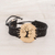 Coconut shell and lava stone macrame pendant bracelet, 'Bare Tree' - Coconut Shell and Lava Stone Tree Pendant Bracelet